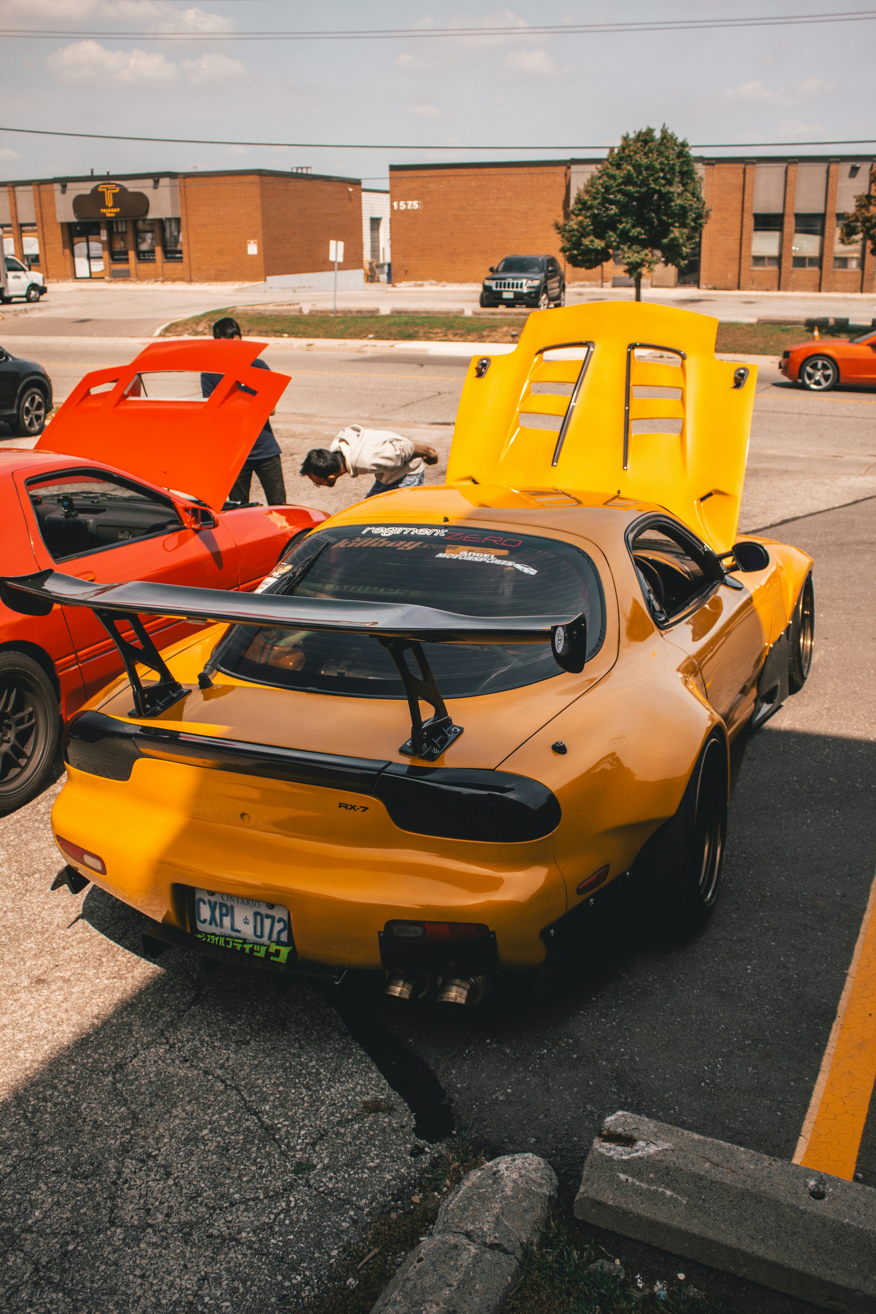 A group of cars parked in a parking lot