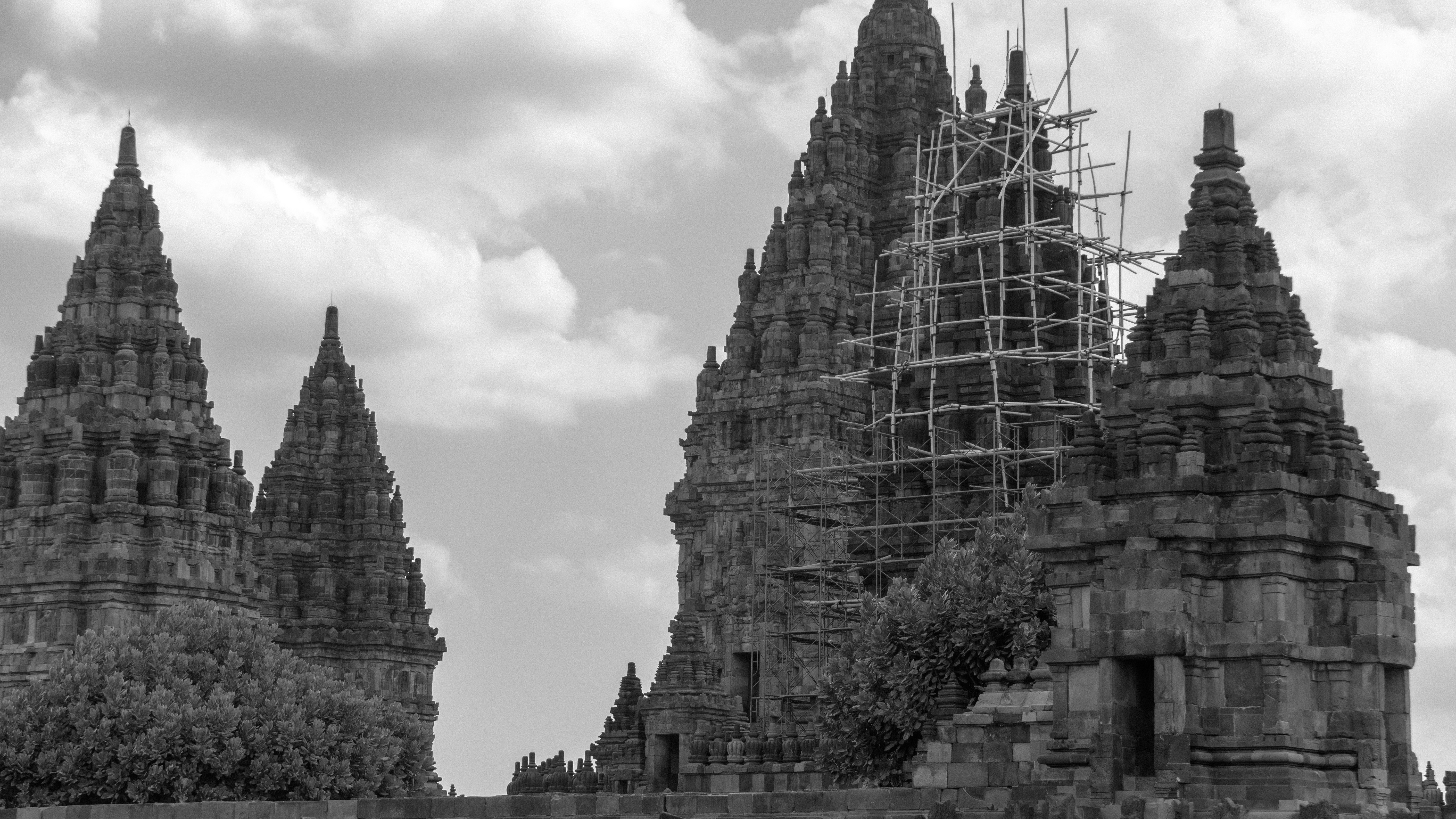 A black and white photo of a castle with scaffolding