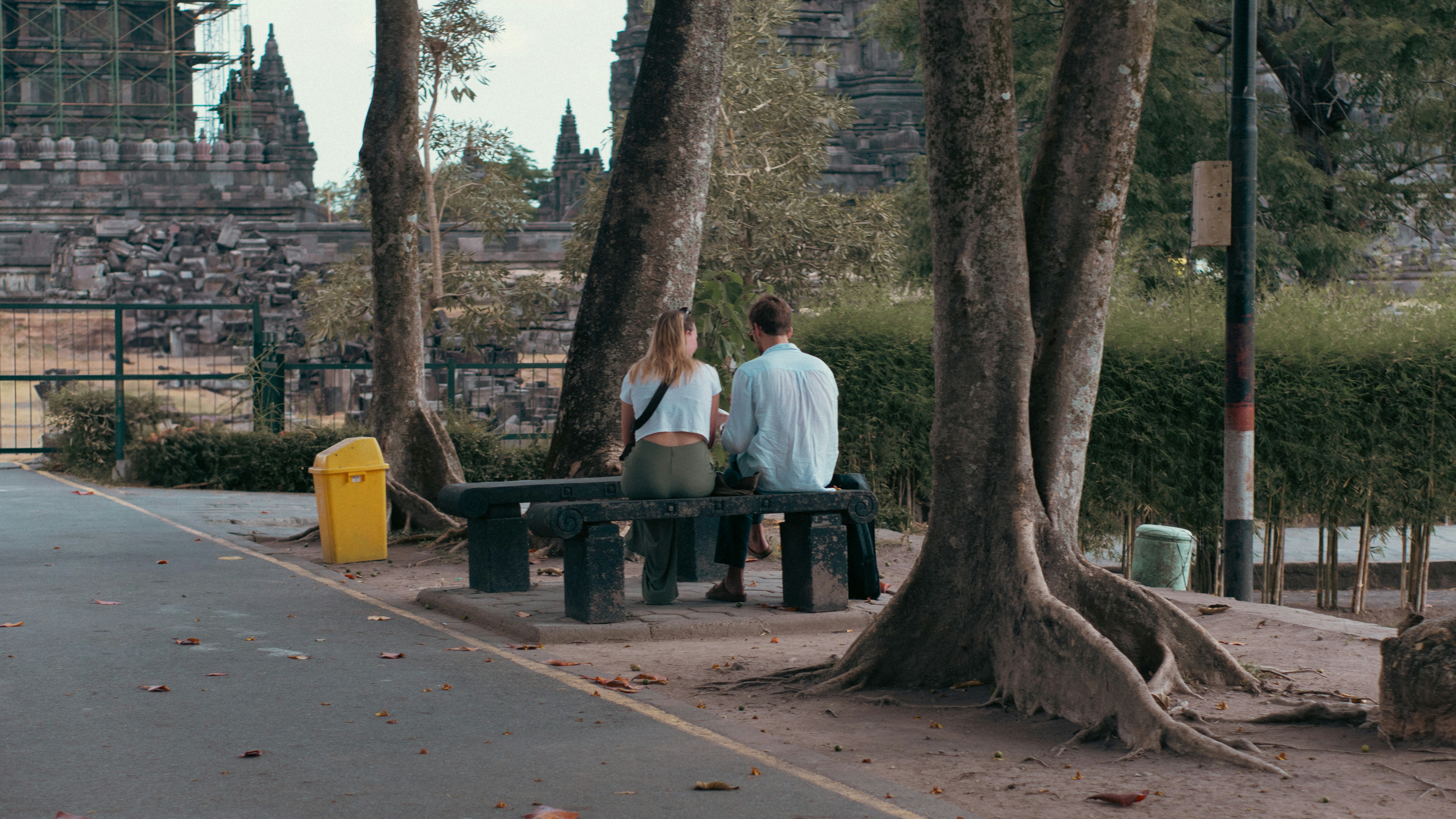 two people talking supportively on a park bench - drug programs