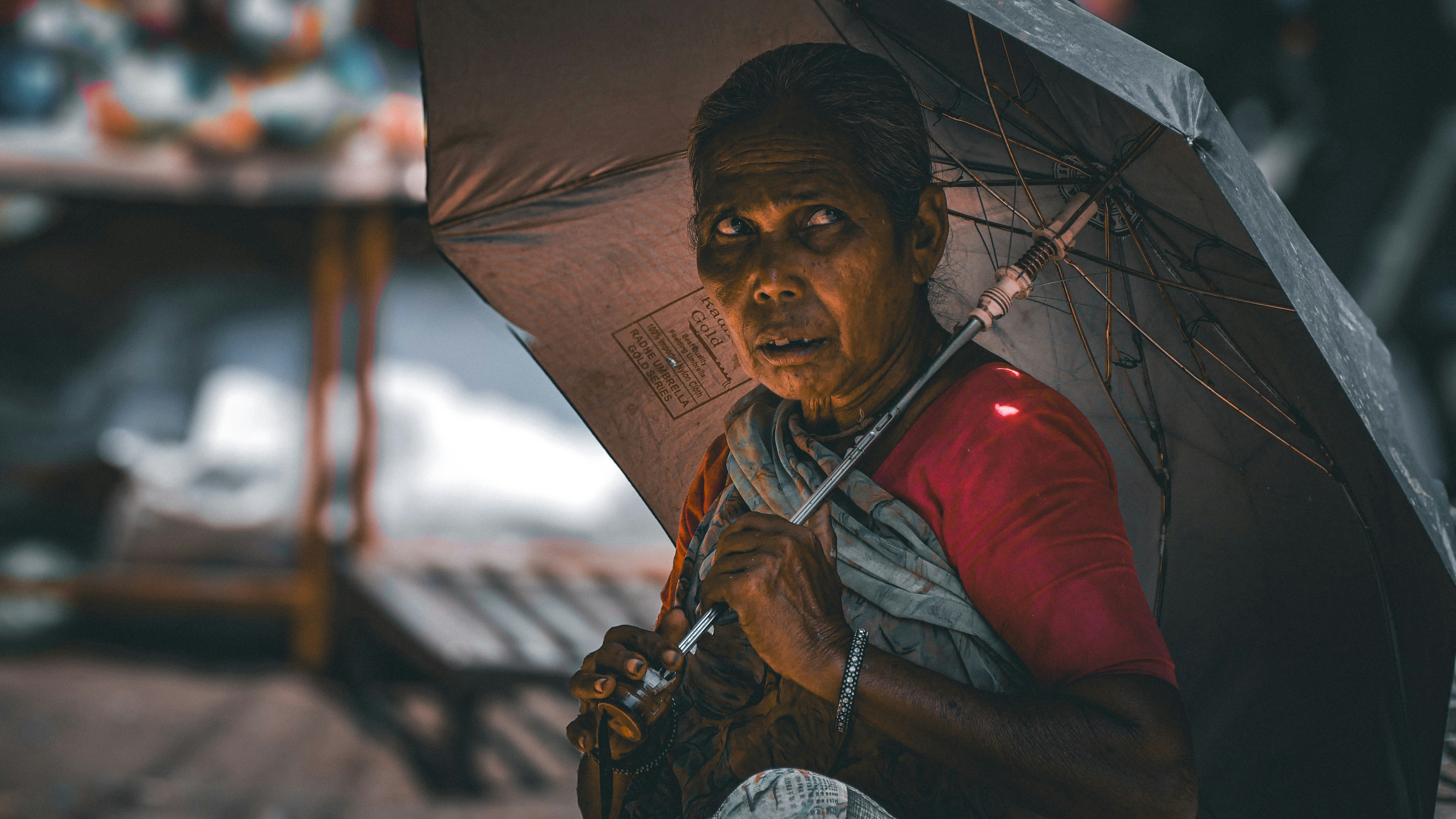 A woman holding an umbrella in the rain