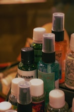 A bunch of bottles of different types and colors