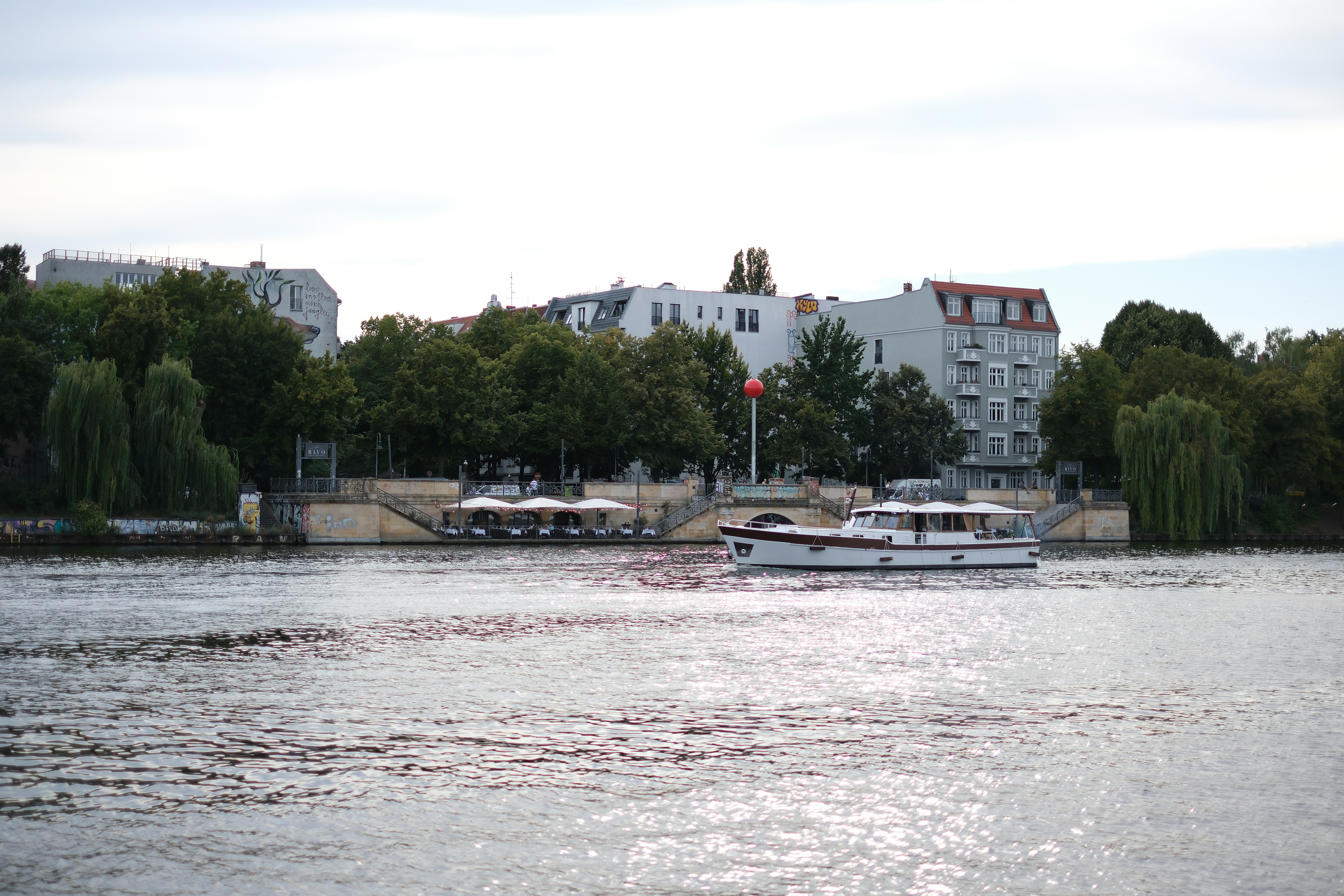 A large body of water with boats floating on it - a-large-body-of-water-with-boats-floating-on-it--REkcYPnvAc
