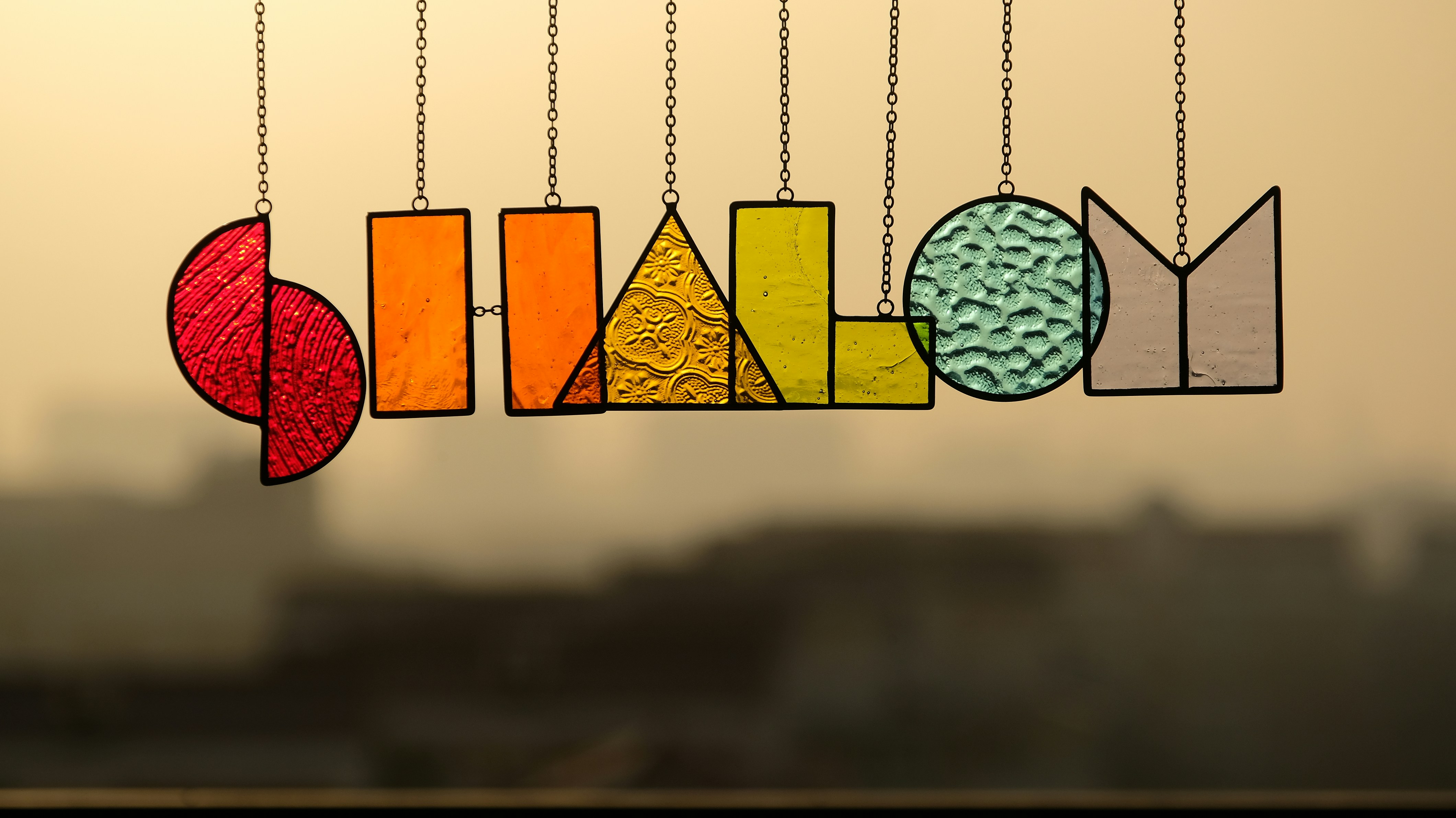 A picture of a mobile with a number of objects hanging from it