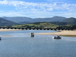 A body of water with boats floating on top of it