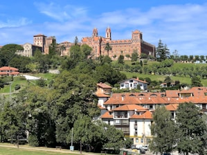 A scenic view of a city with a castle in the background