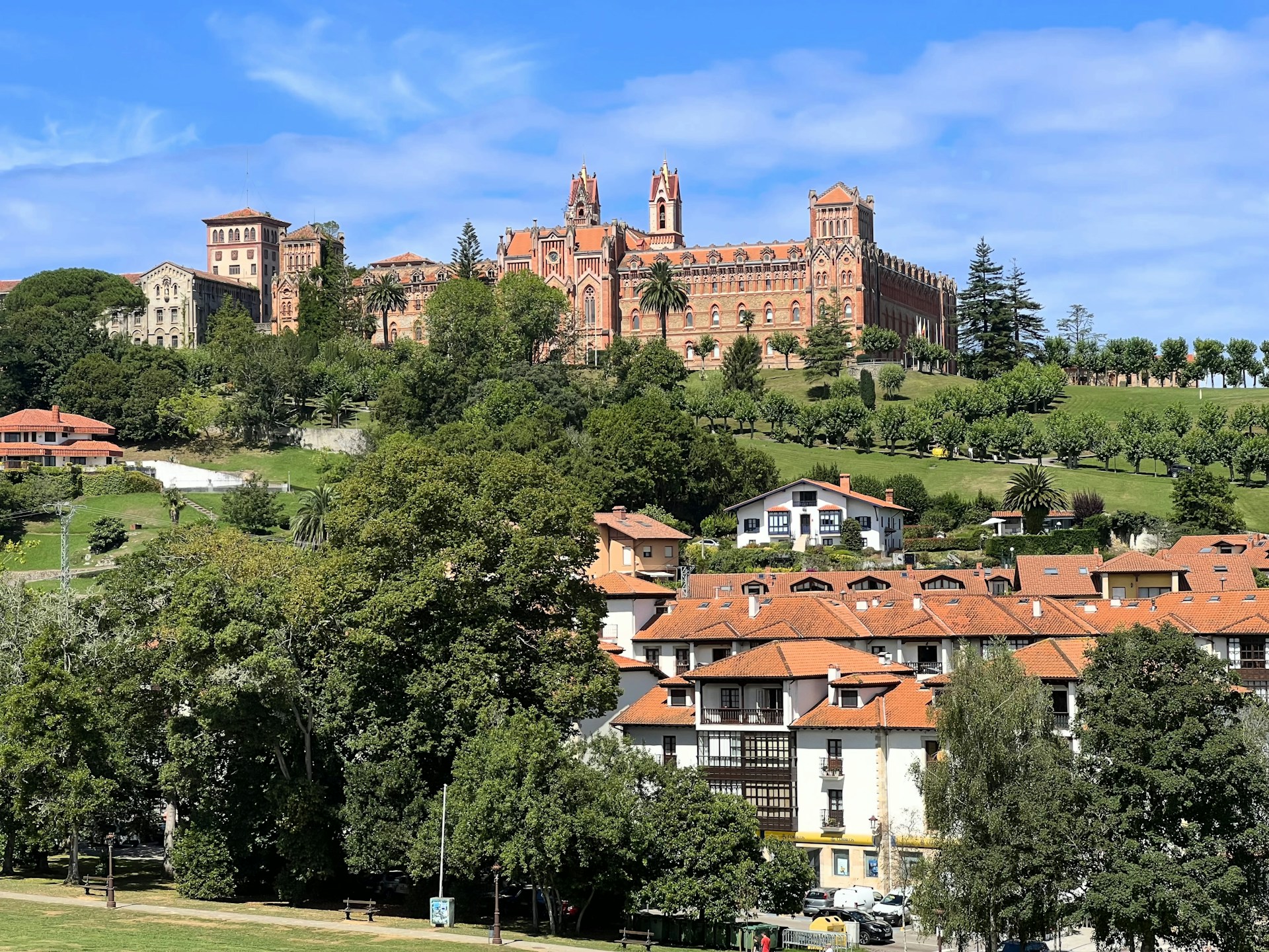 A scenic view of a city with a castle in the background