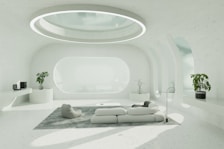 A living room with a white couch and a round window