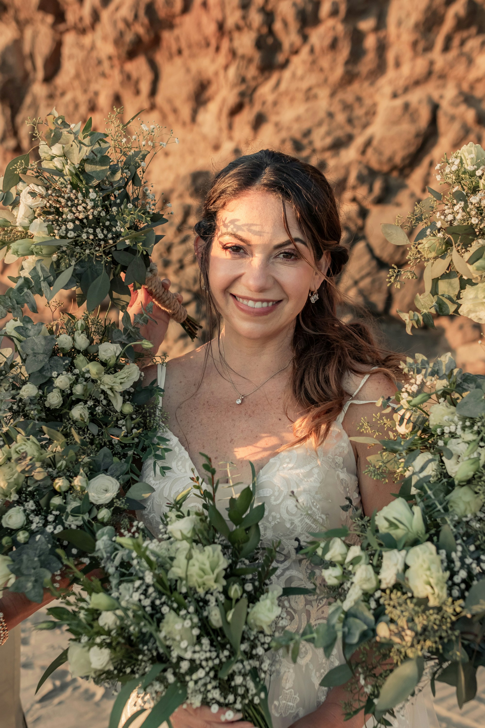 A woman holding a bunch of flowers in her hands