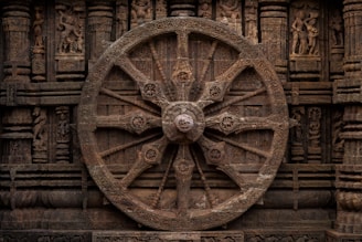 A large wheel on the side of a building