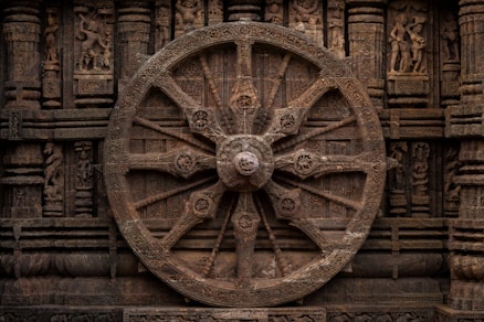 A large wheel on the side of a building