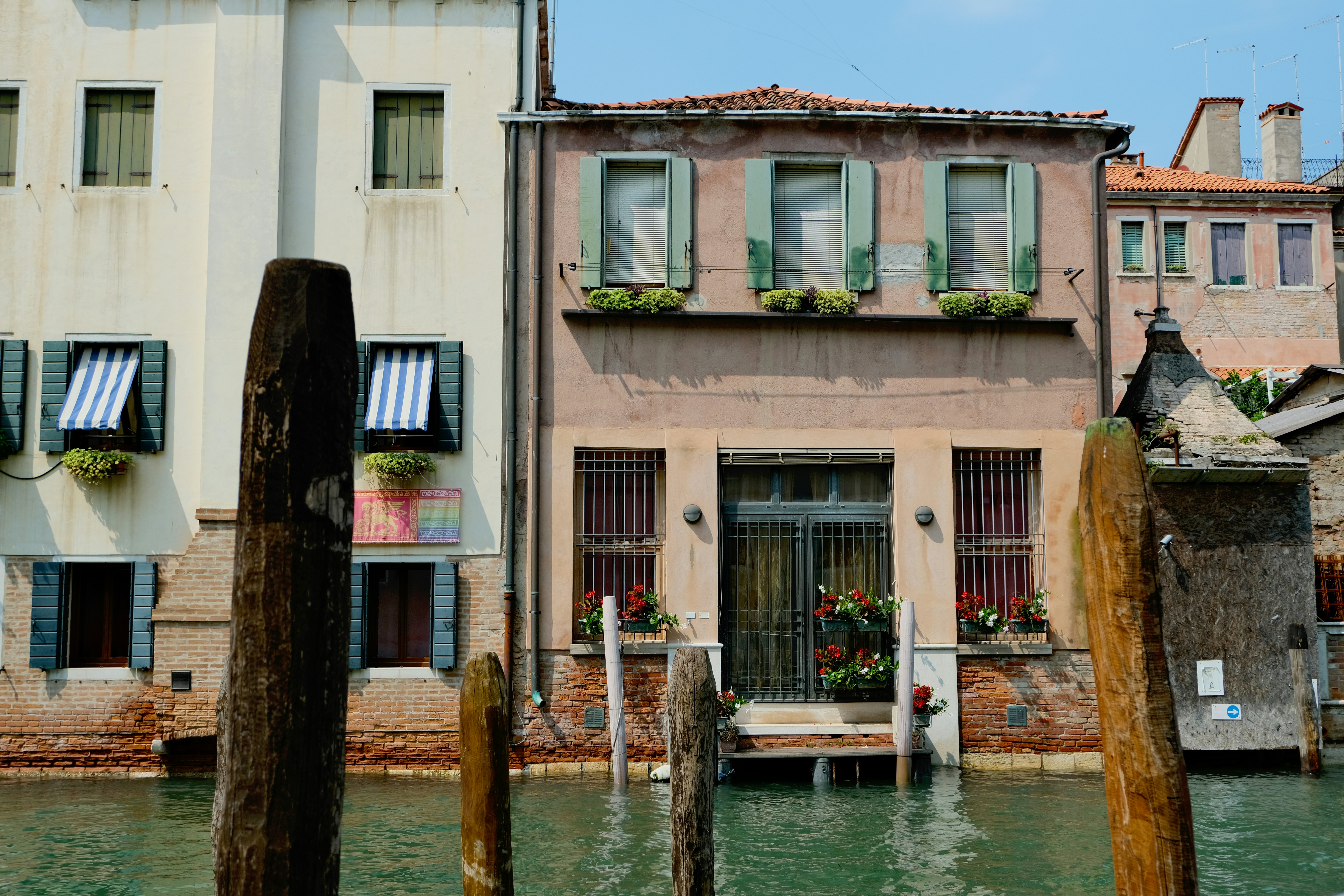 A couple of buildings sitting next to a body of water