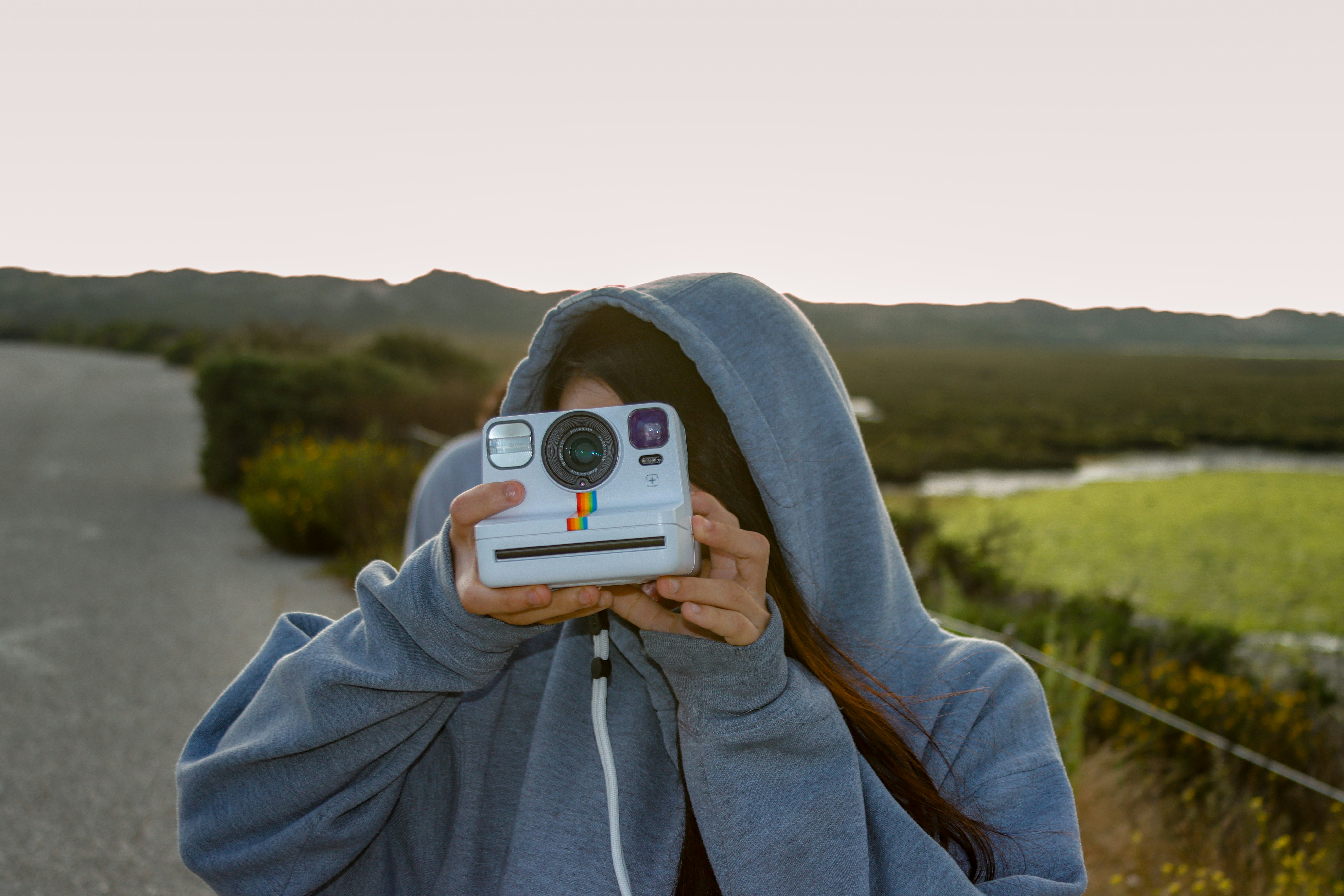 A person taking a picture with a camera