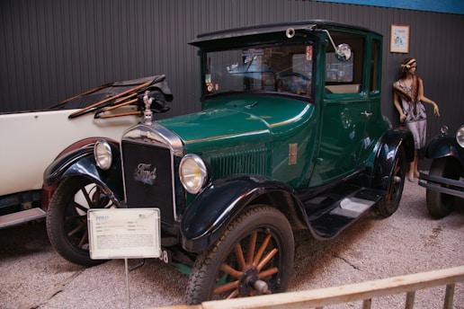 An antique car is on display in a museum