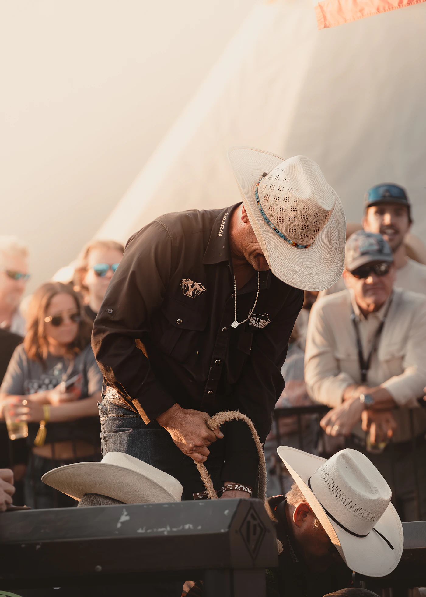 Crowd watching a cowboy