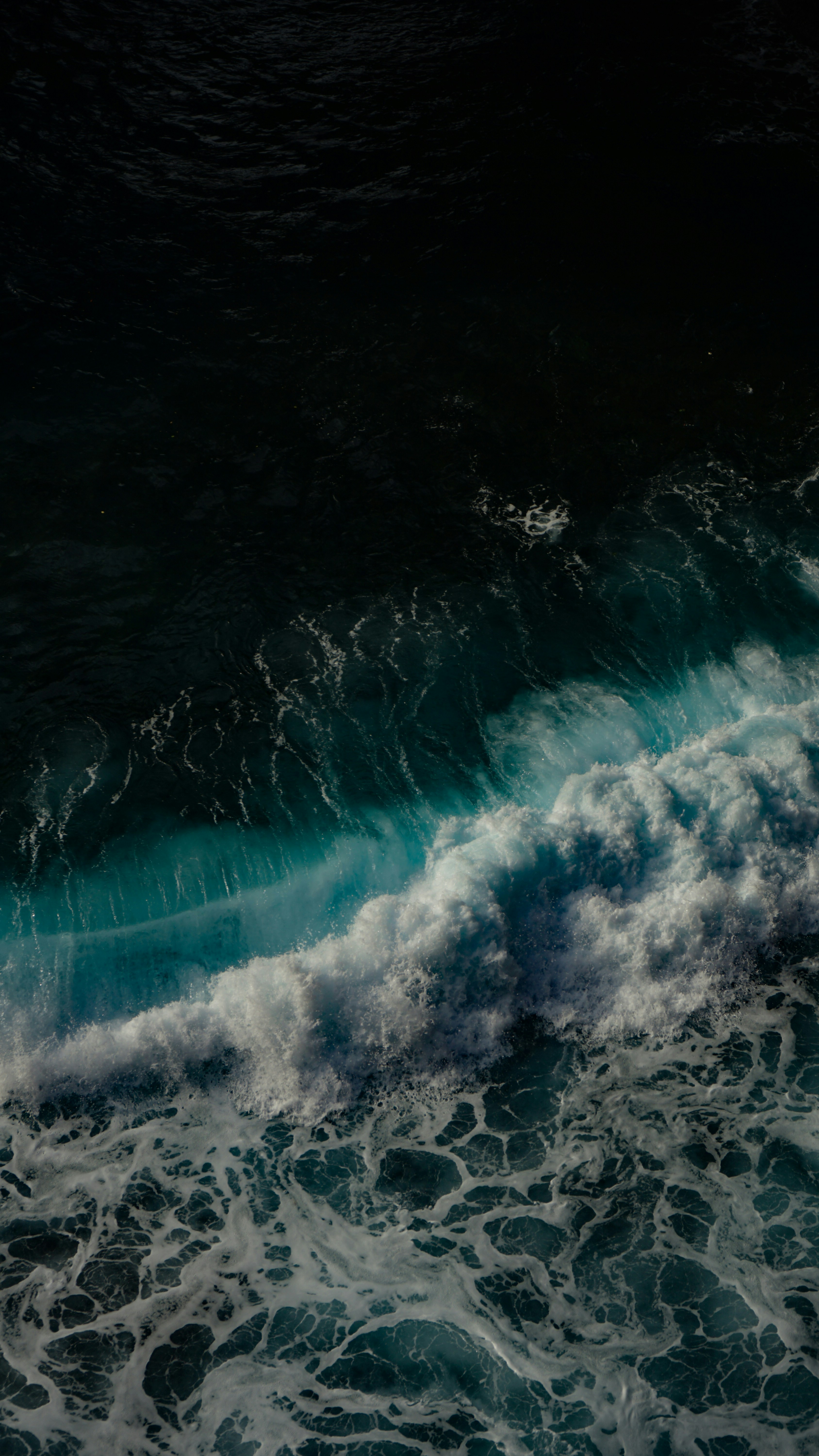 A surfer riding a wave in the ocean