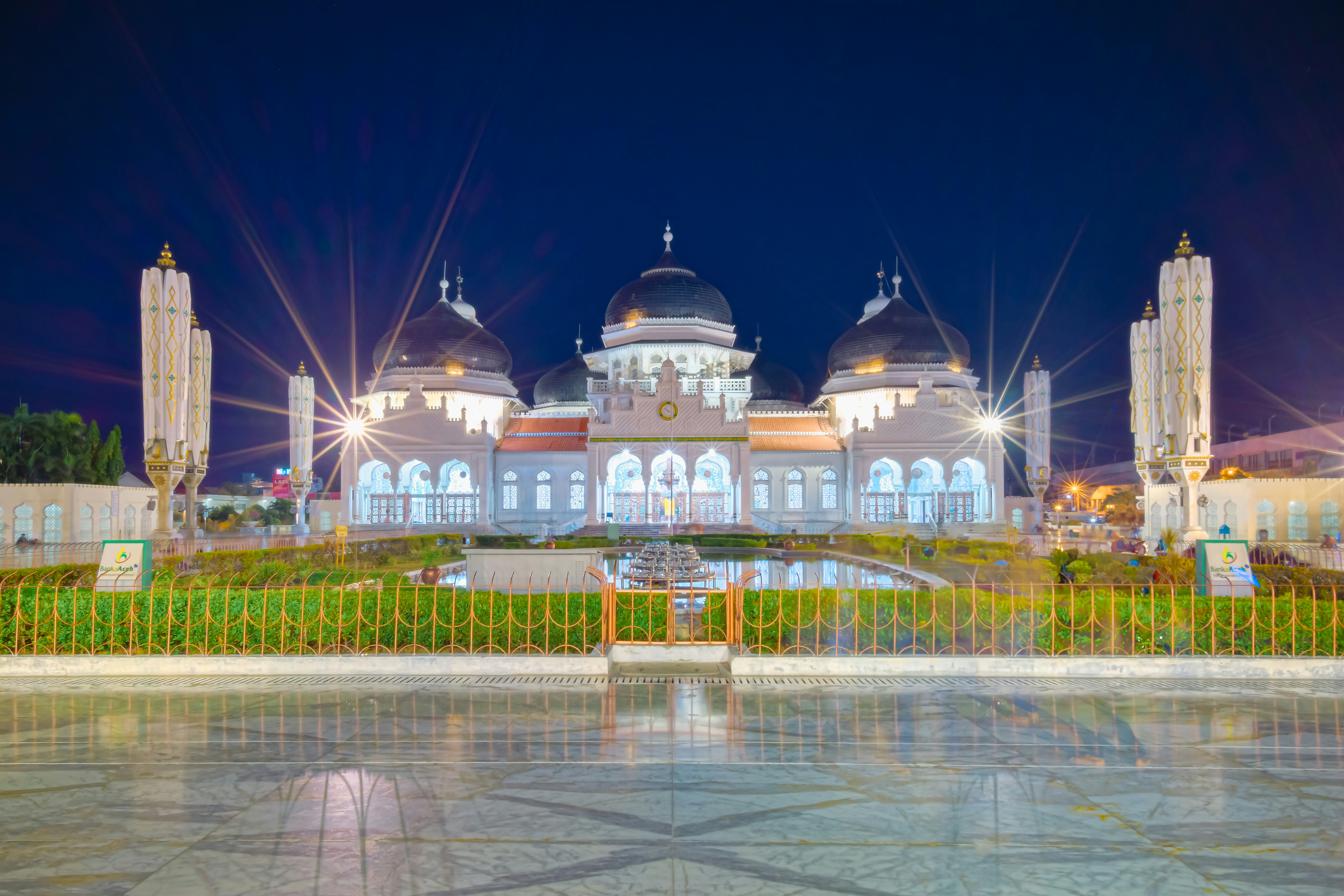 A large building with a fountain in front of it