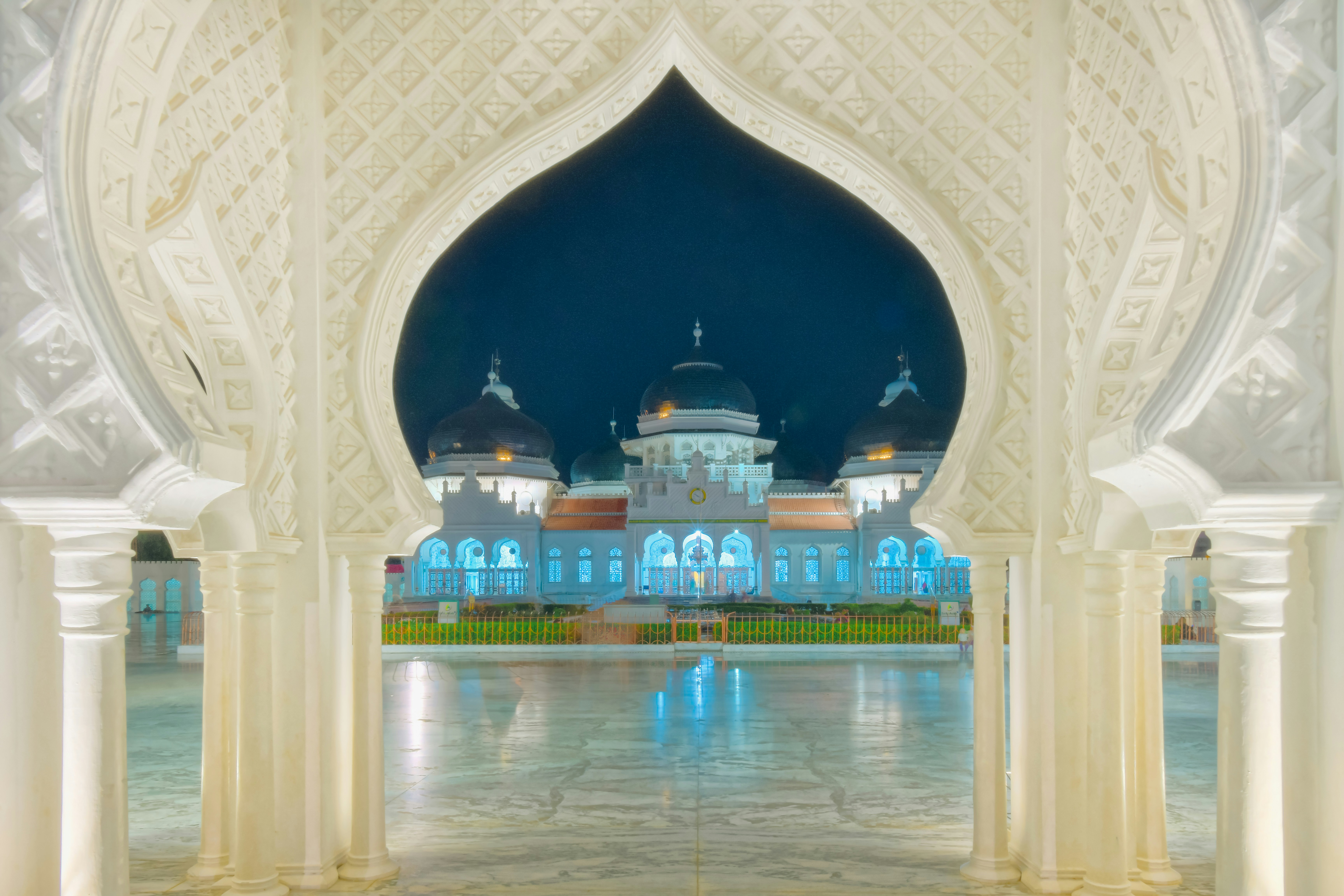 A large white building with a blue dome