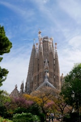 A tall building with many spires on top of it