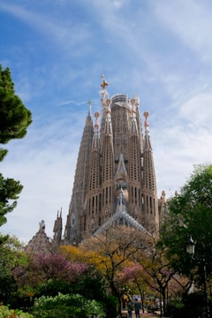 A tall building with many spires on top of it