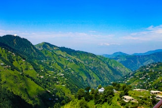 A view of a valley and mountains from a balcony