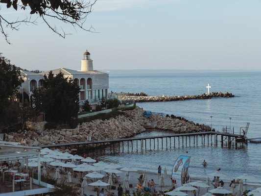 A view of a body of water with a lighthouse in the distance — Varna, Bulgaria