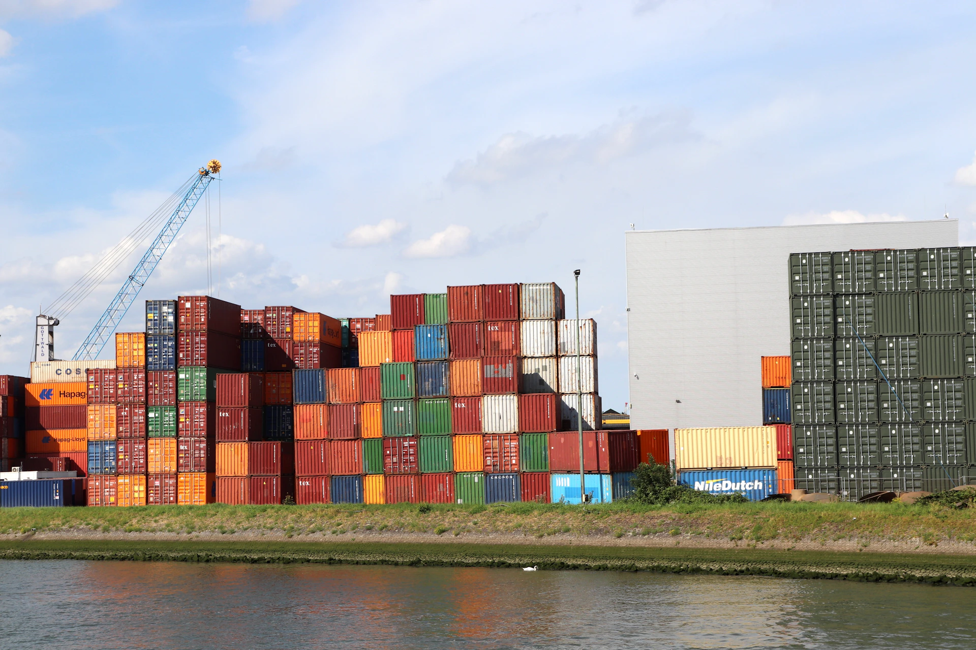 A body of water with a bunch of containers on top of it