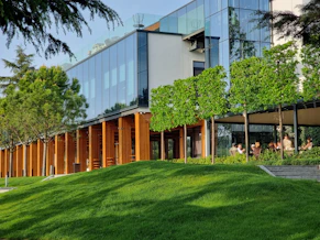 A building with a grassy lawn in front of it