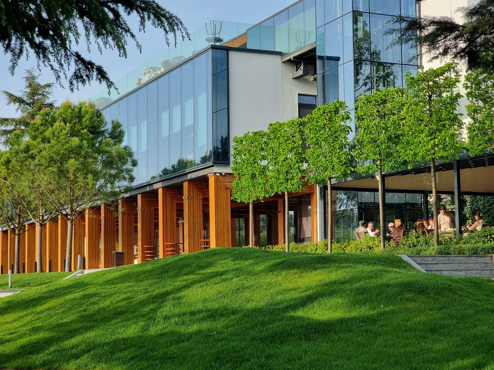 A building with a grassy lawn in front of it