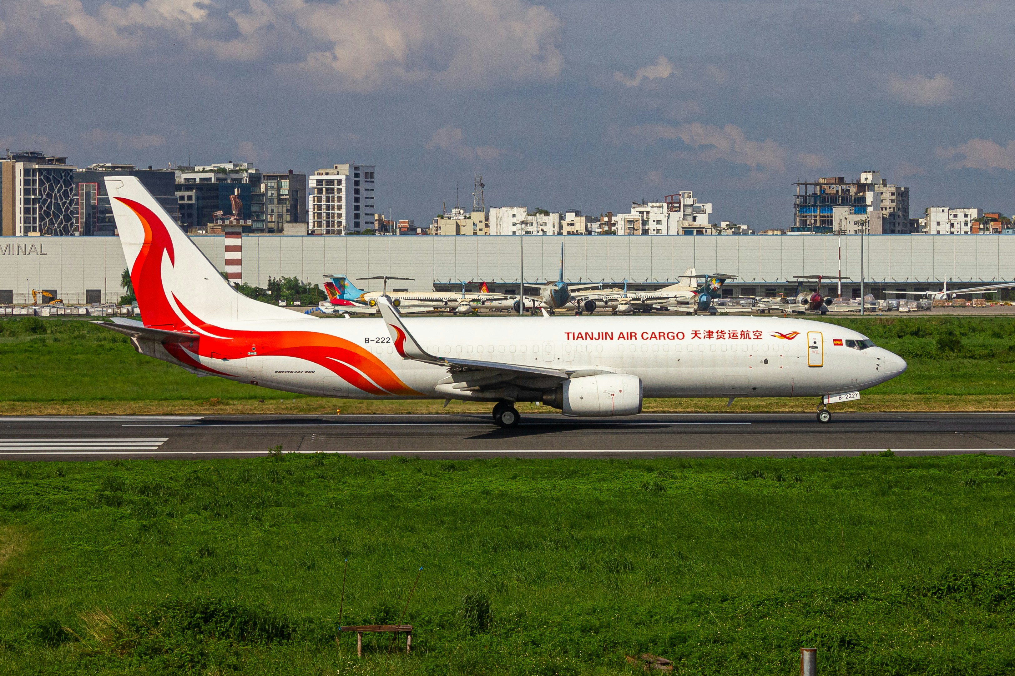 A large jetliner sitting on top of an airport runway, Tianjin Air Cargo rolling for takeoff 🛫