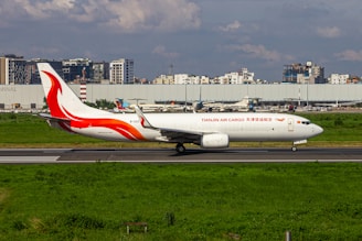 A large jetliner sitting on top of an airport runway
