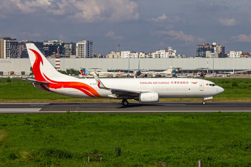 A large jetliner sitting on top of an airport runway