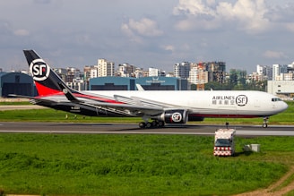 A large jetliner sitting on top of an airport runway