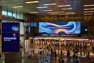 A group of people walking through an airport