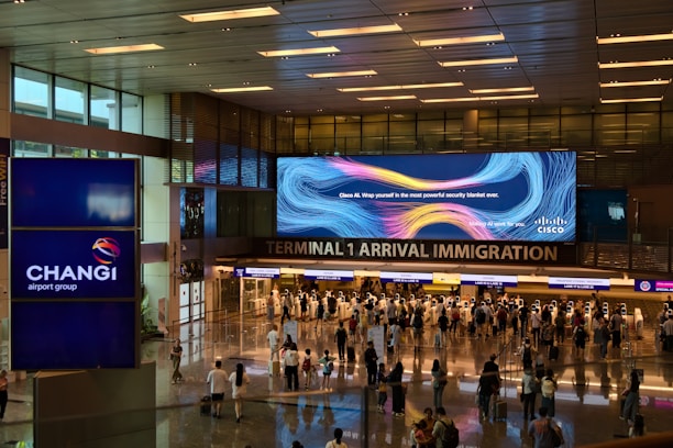 A group of people walking through an airport