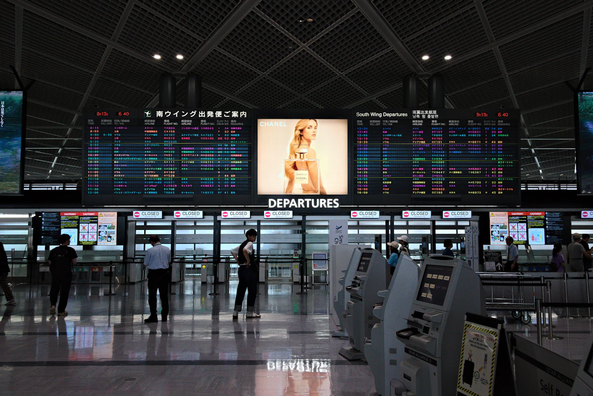 Digital signage and information boards inside Narita Airport terminal