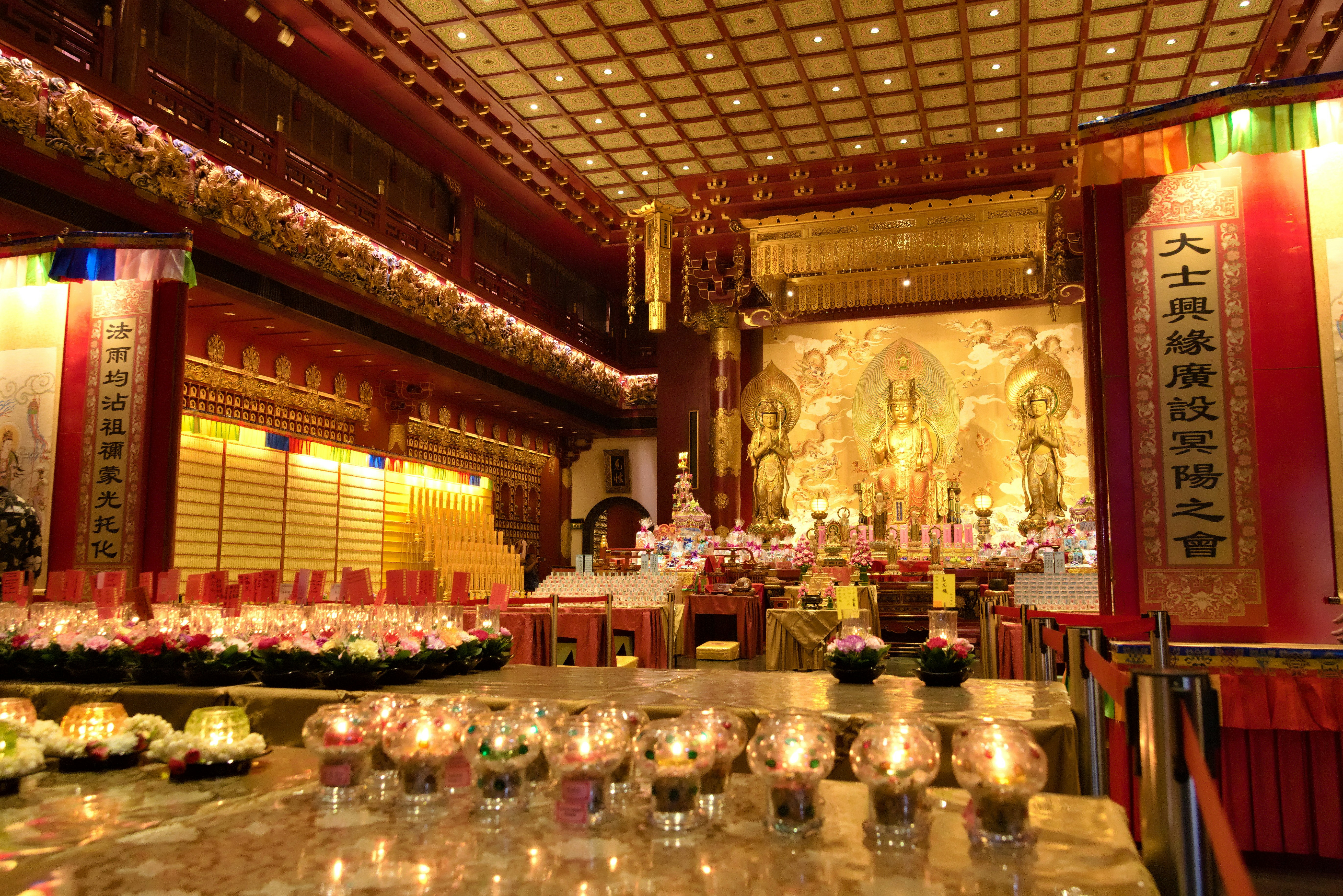 A large room with a bunch of candles on the table