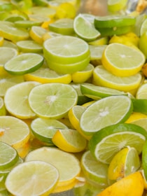 A bunch of lemons and limes on a table