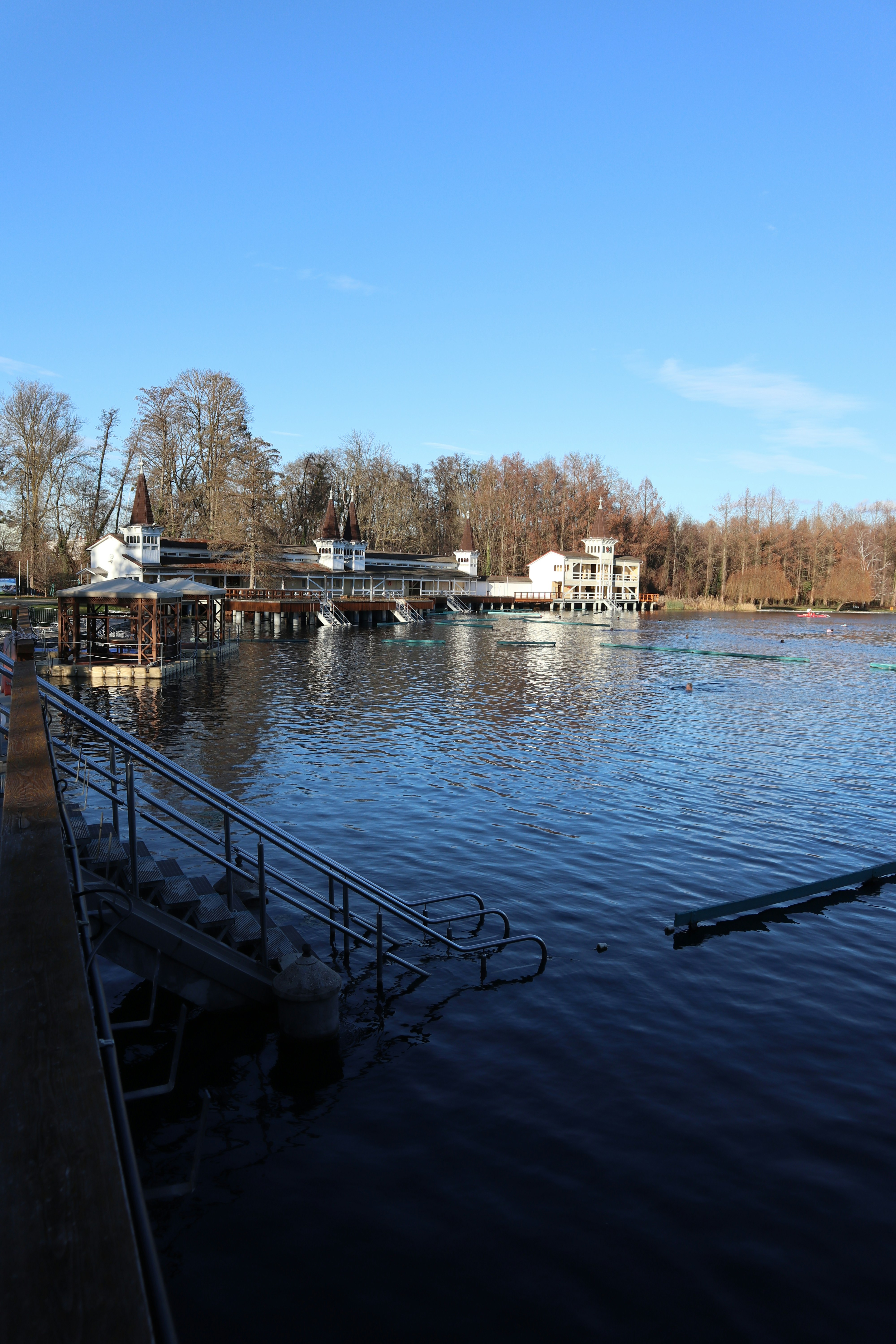 A body of water next to a dock