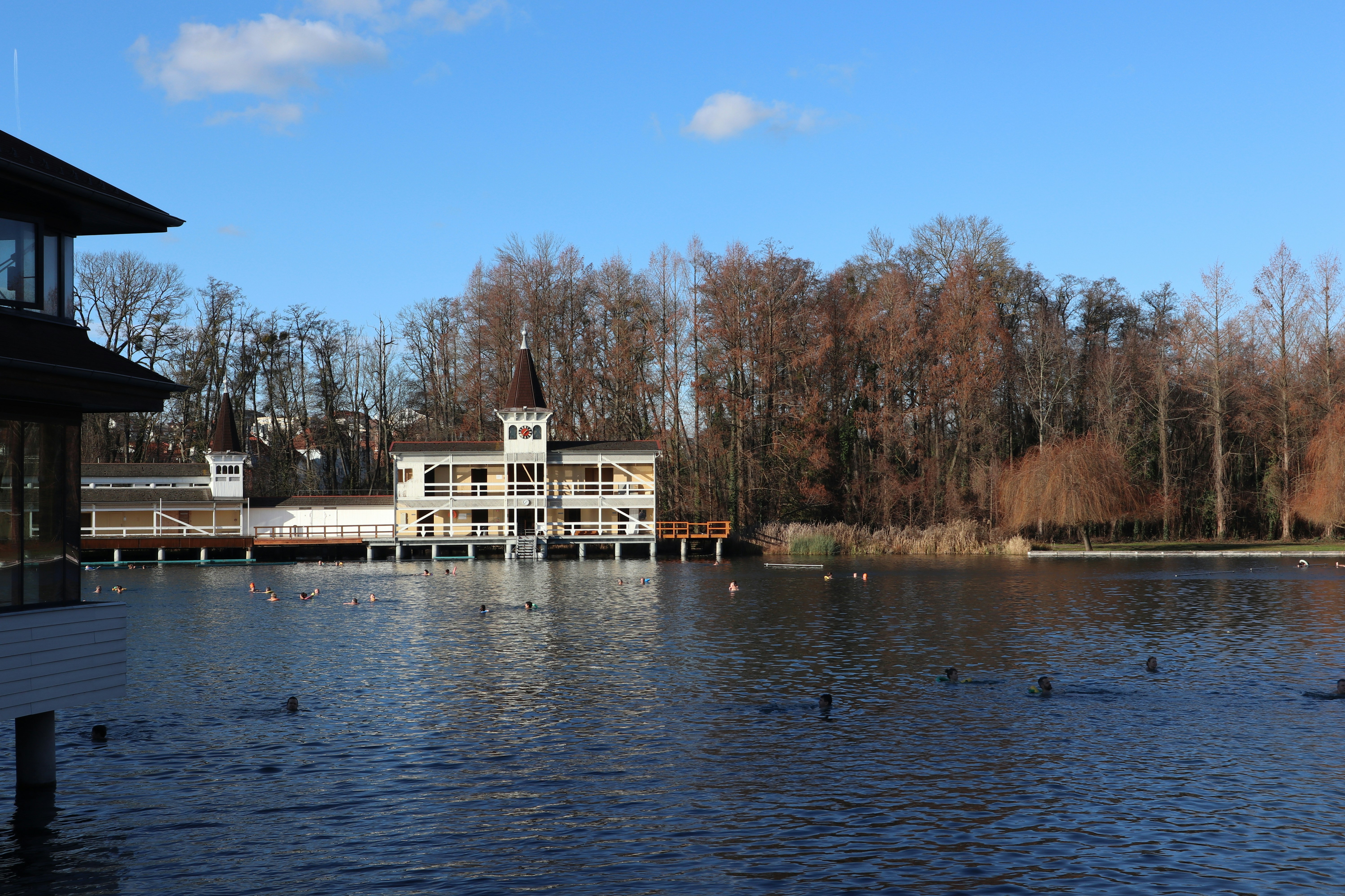 A large body of water with a building in the background