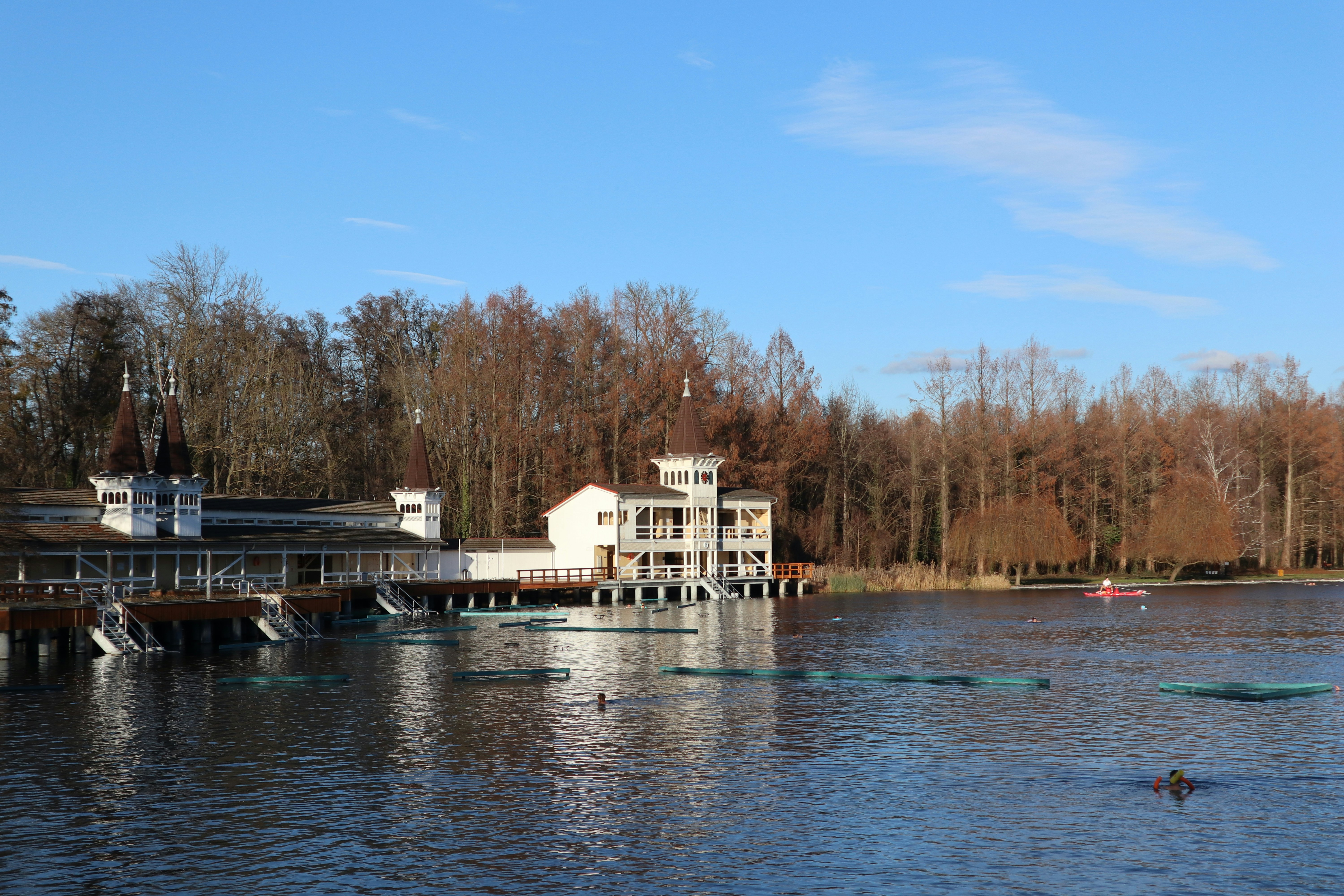 A body of water with a building in the background, 