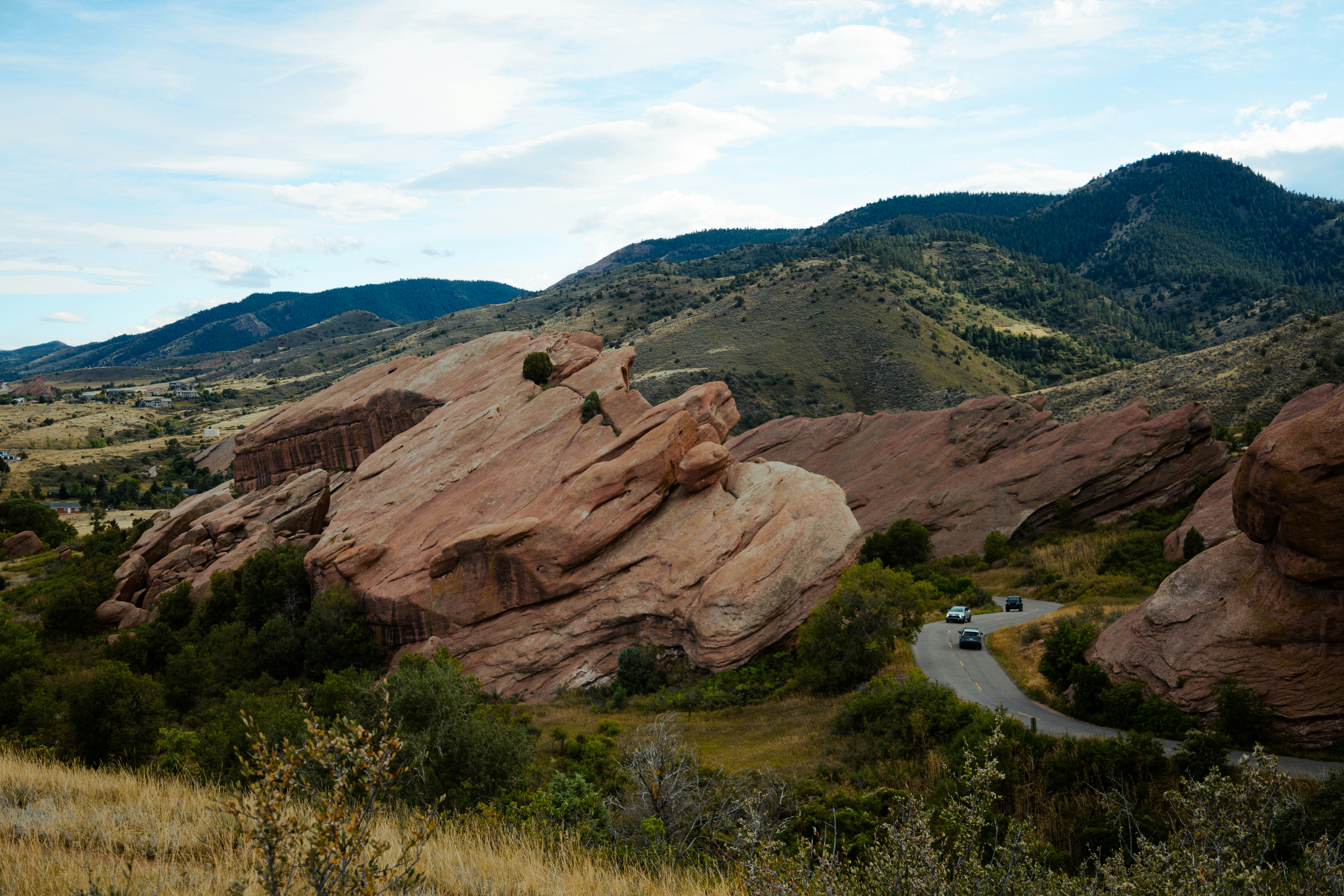 A scenic view of mountains and a road
