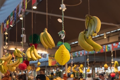 A bunch of bananas hanging from a ceiling