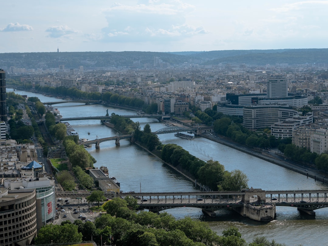 A river running through a city next to a bridge,