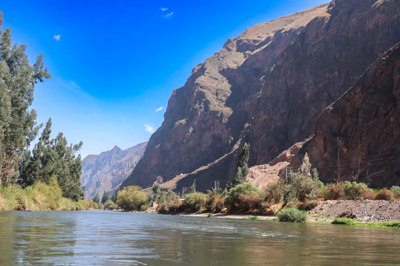 The Urubamba River winding through the Sacred Valley between mountains