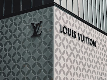 A louis vuitton sign on the side of a building