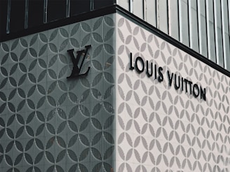 A louis vuitton sign on the side of a building