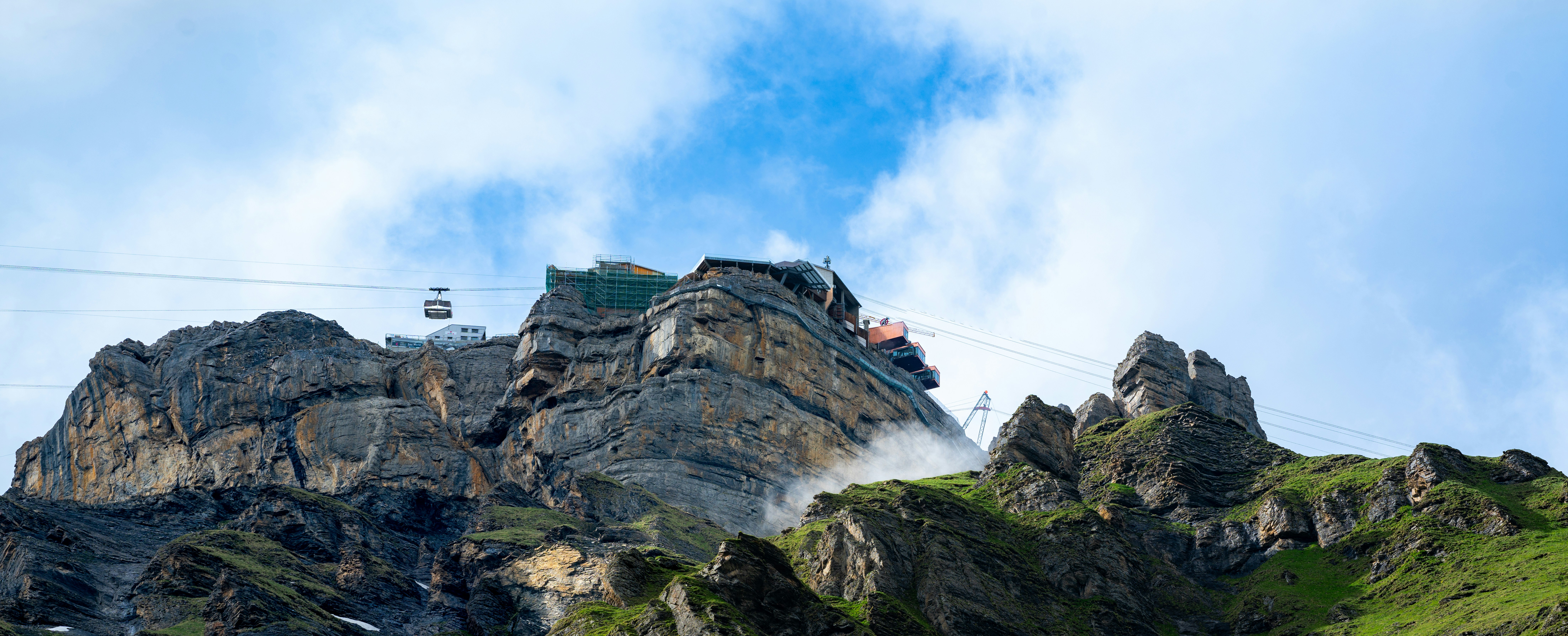 A mountain is shown with a sky background
