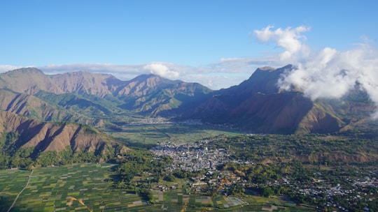 An aerial view of a city and mountains