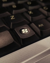 A close up of a computer keyboard with the key missing