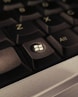 A close up of a computer keyboard with the key missing